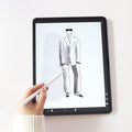 Hand holding a stylus on a tablet displaying a sketch of a fashionable suit, representing the Free Intro Call with Fashion Design Studio Concept2Wear.